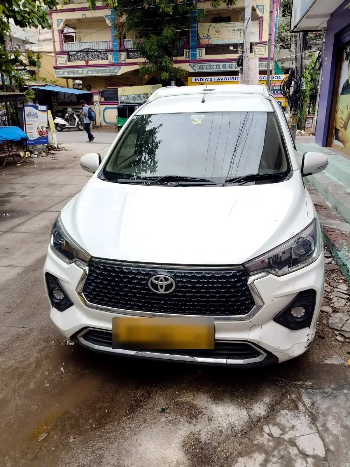 White Toyota Rumion — front view