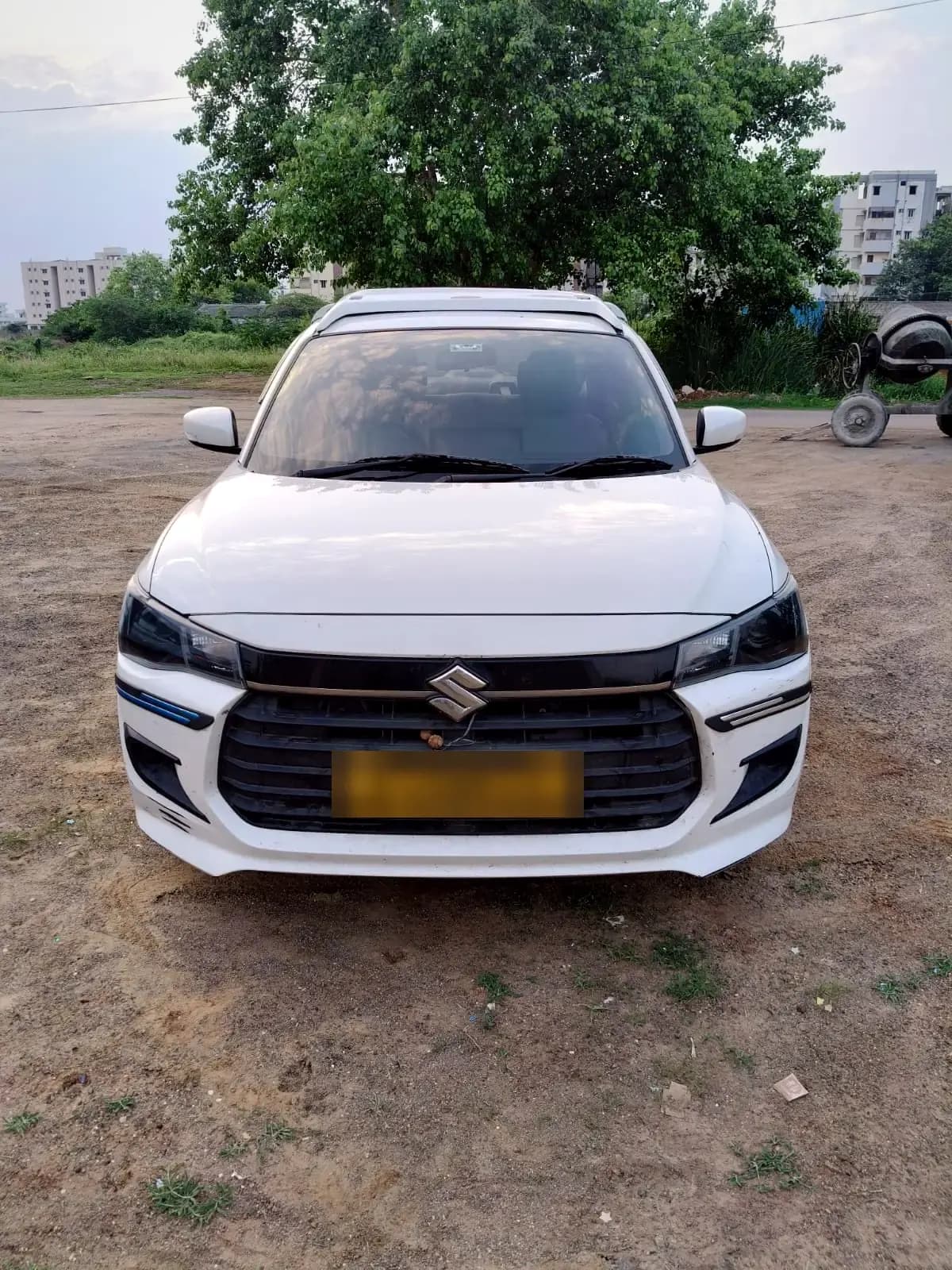 White Maruti Suzuki Dzire — front view