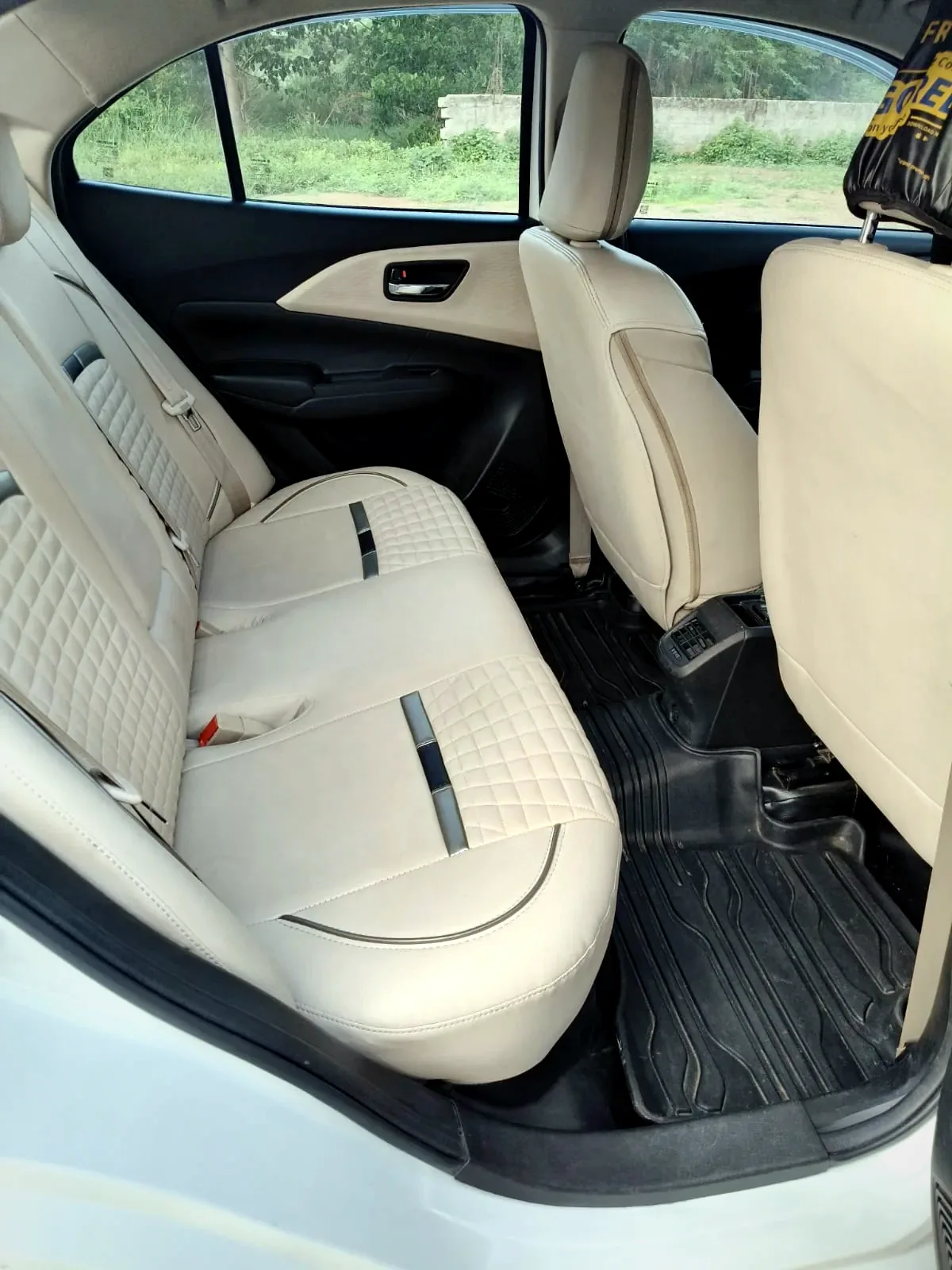 Dzire rear passenger seats — clean beige interior