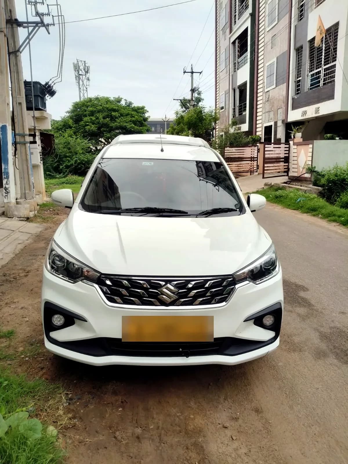 White Maruti Suzuki Ertiga — front view