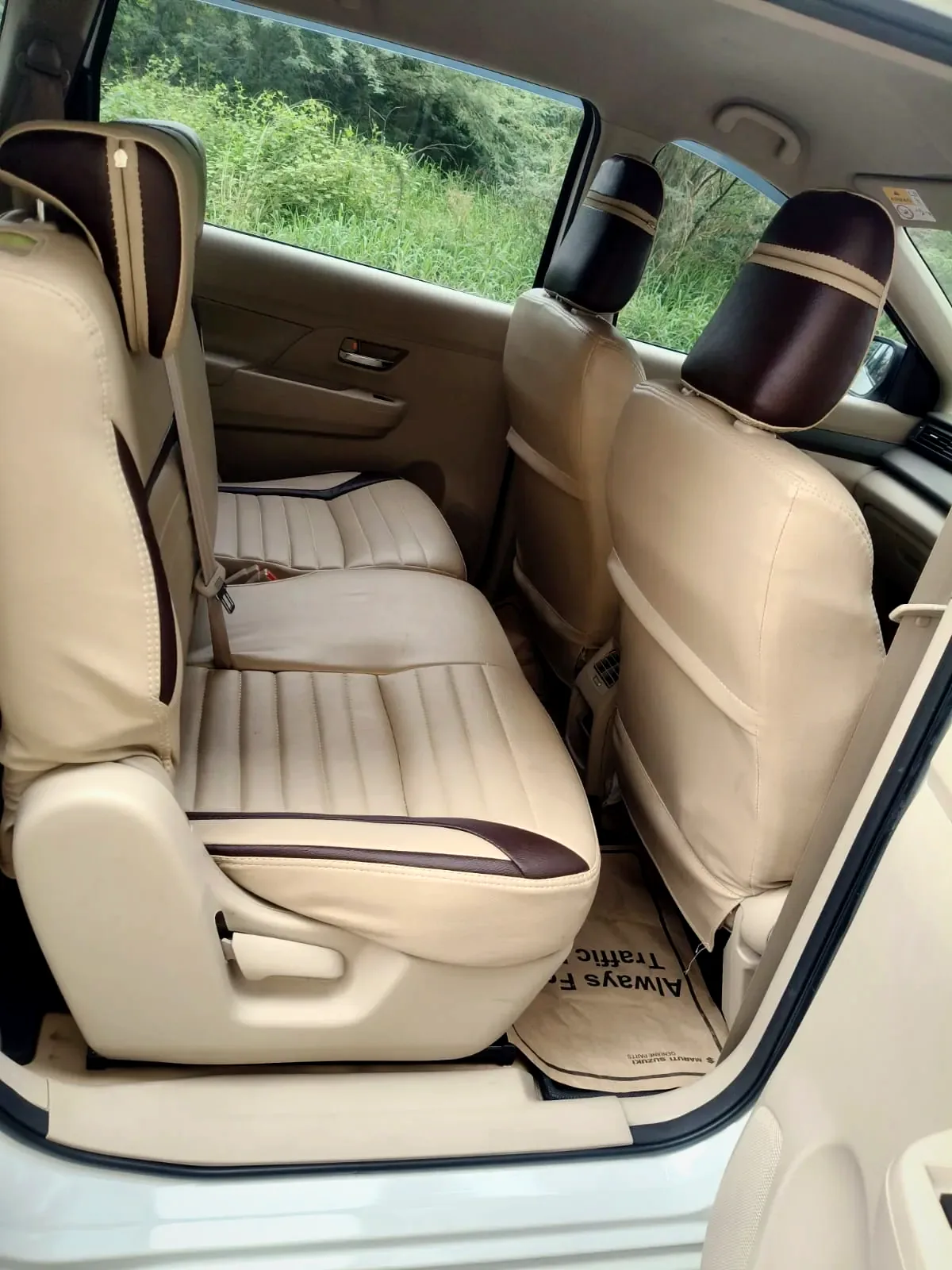 Ertiga rear passenger seats — clean beige interior